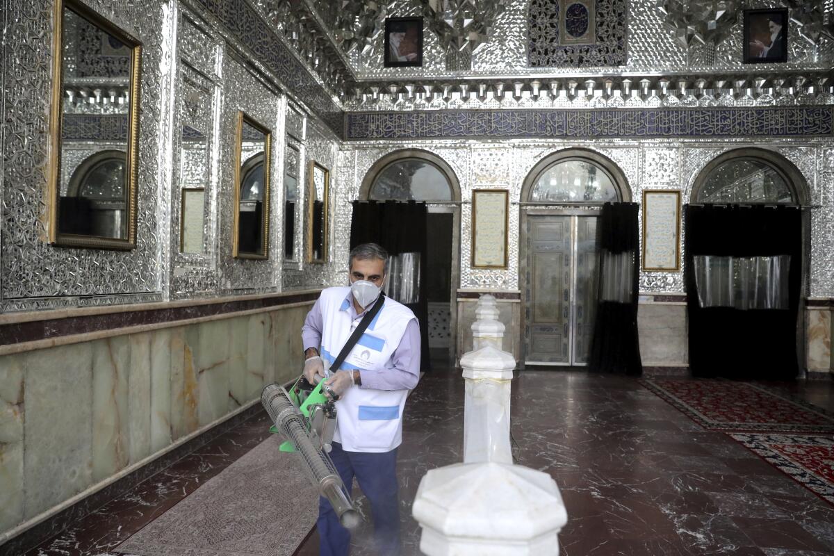 A man disinfects the shrine of the Shiite Saint Imam Abdulazim in Shahr-e-Ray, Iran.