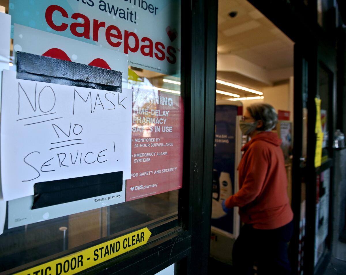 The CVS store on the 500 block of N. Hollywood Way has a sign reminding customers to wear a face mask.