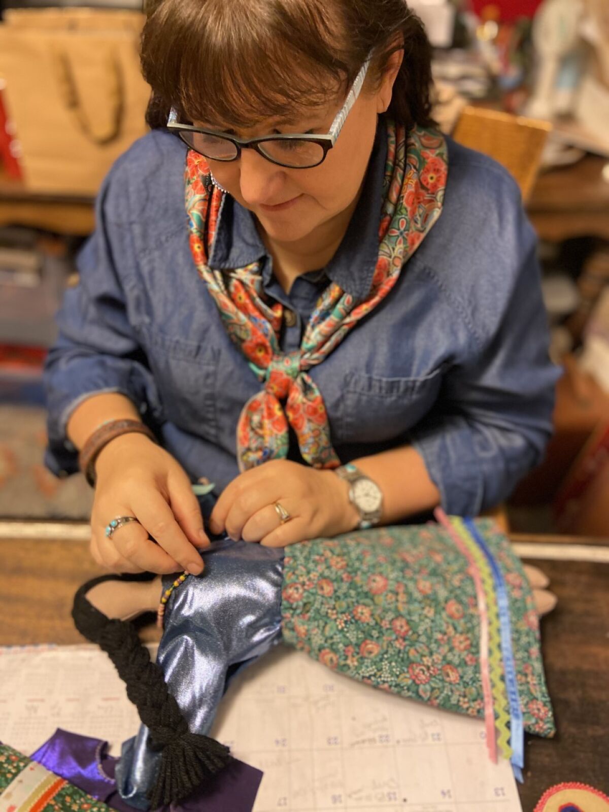 McCleary works on one of her Fierce One dolls.