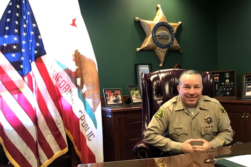 L.A. County Sheriff Alex Villanueva poses for a portrait in his office.