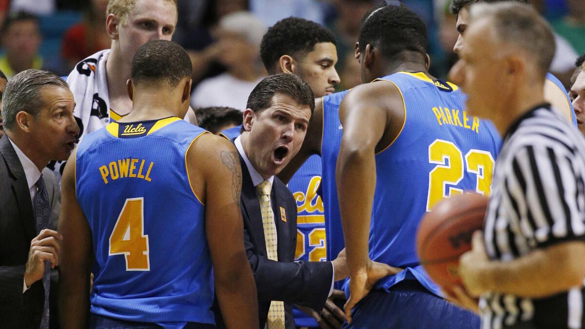 UCLA Coach Steve Alford speaks to his players during a Pac-12 tournament semifinal loss to Arizona on Friday.