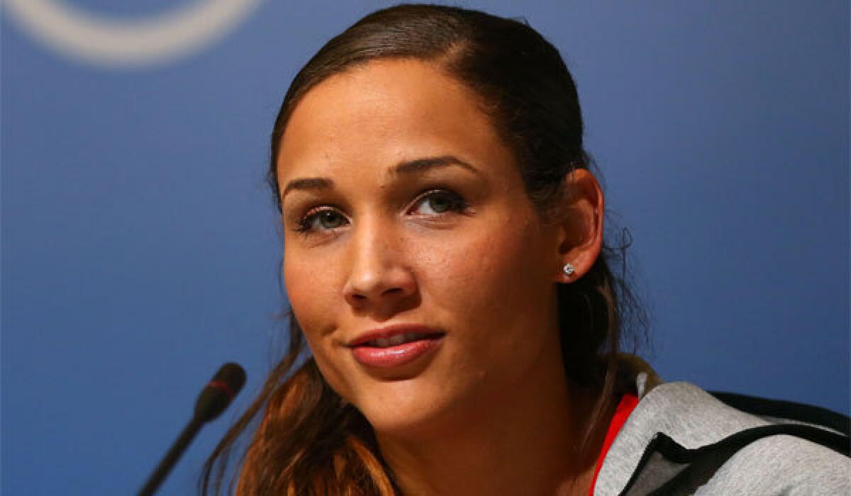 Lolo Jones attends a women's bobsled team news conference in the Olympic Park ahead of the 2014 Sochi Olympics.