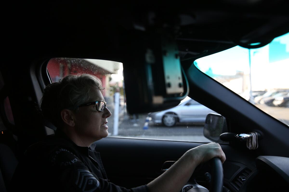 LA Times Columnist, Steve Lopez, checks the tires of LA City Deputy News Photo - Getty Images