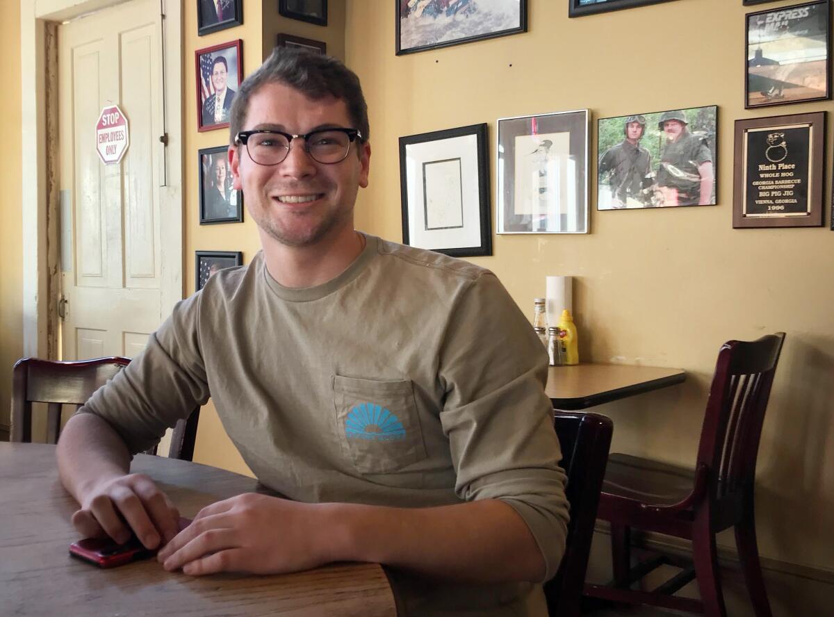 Brett Smith works as a dishwasher at the Redneck Gourmet deli in Newnan, Ga.