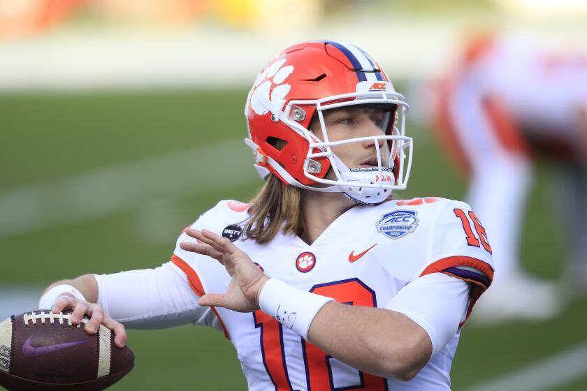 Clemson quarterback Trevor Lawrence (16) warms up before the start of the Atlantic Coast Conference championship NCAA college football game, Saturday, Dec. 19, 2020, in Charlotte, N.C. (AP Photo/Brian Blanco)