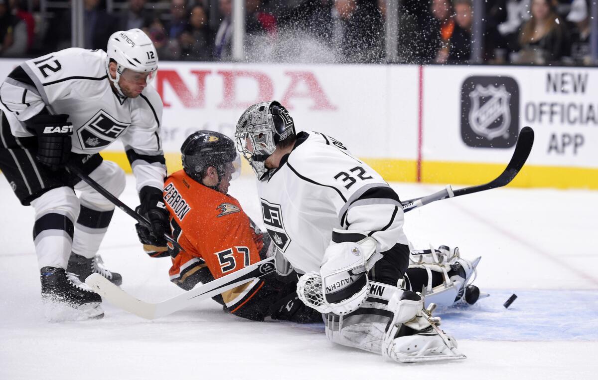 Ducks left wing David Perron, center, scores against Kings goalie Jonathan Quick and right wing Marian Gaborik on Feb. 4. Perron and Gaborik are two of the many injured as the playoffs open.