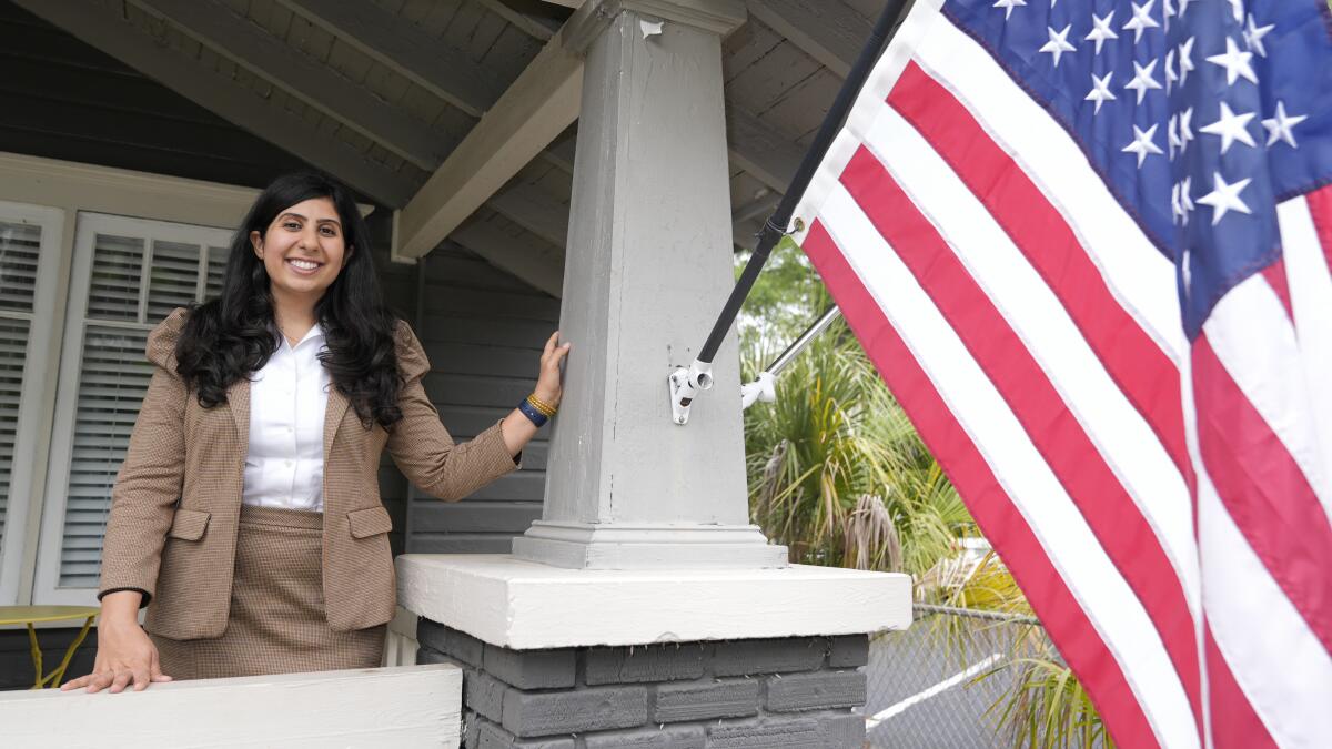 Florida state Rep. Anna Eskamani stands by a U.S. flag outside her office.