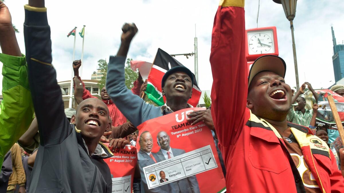 Supporters of Kenyan President Uhuru Kenyatta celebrate in Nairobi on Nov. 20 after the country's Supreme Court upheld Kenyatta's reelection in a controversial rerun vote.