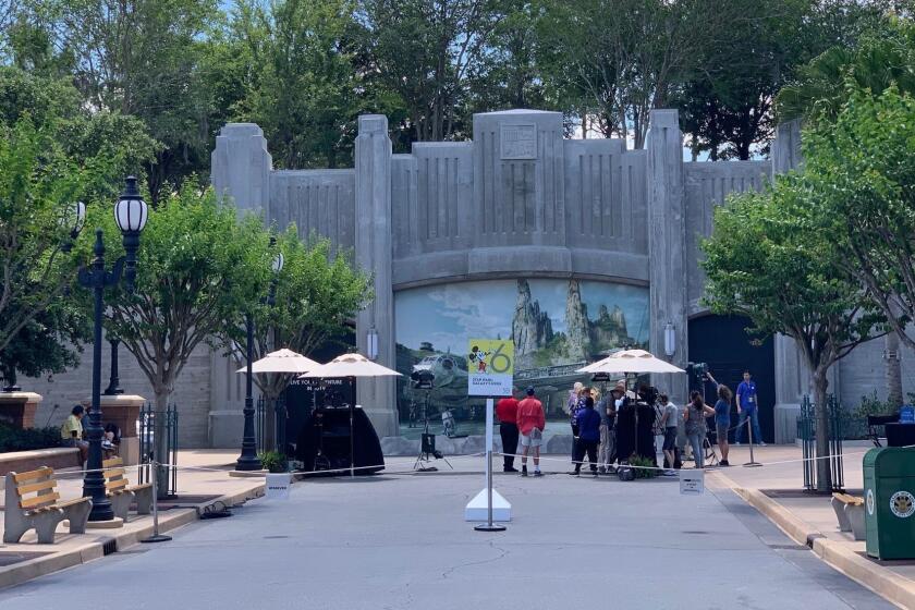 A formidable barrier keeps eyes off of most of the construction for Star Wars: Galaxy's Edge, which opens in August at Disney's Hollywood Studios theme park.