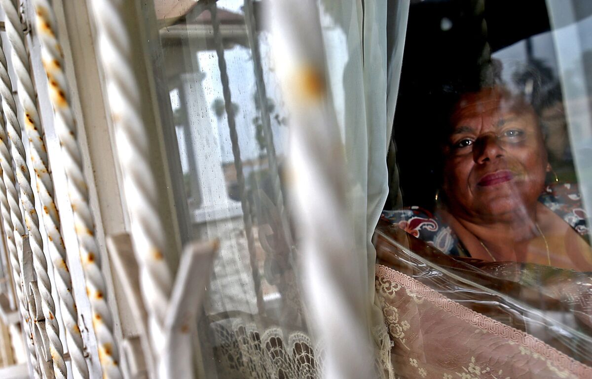 Rita Banks looks out the window of her home in the South L.A. neighborhood known as Chesterfield Square. Per capita, the area leads the city in violent crimes. But Banks and other residents are fighting back by helping police with suspect descriptions and frequent tips.