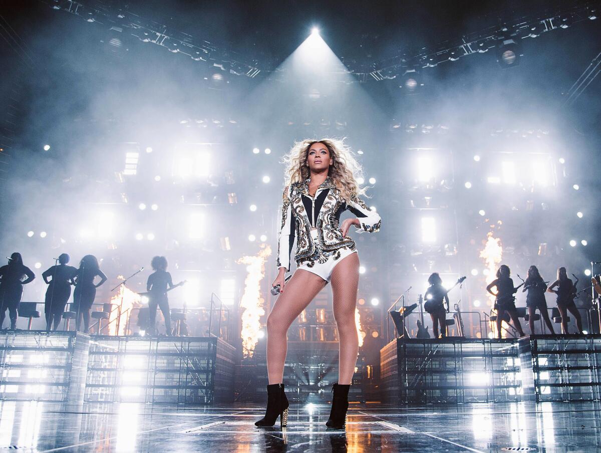 Beyonce performs onstage at her "Mrs. Carter Show World Tour 2013," on Friday, Dec. 13, 2013 at the United Center in Chicago.