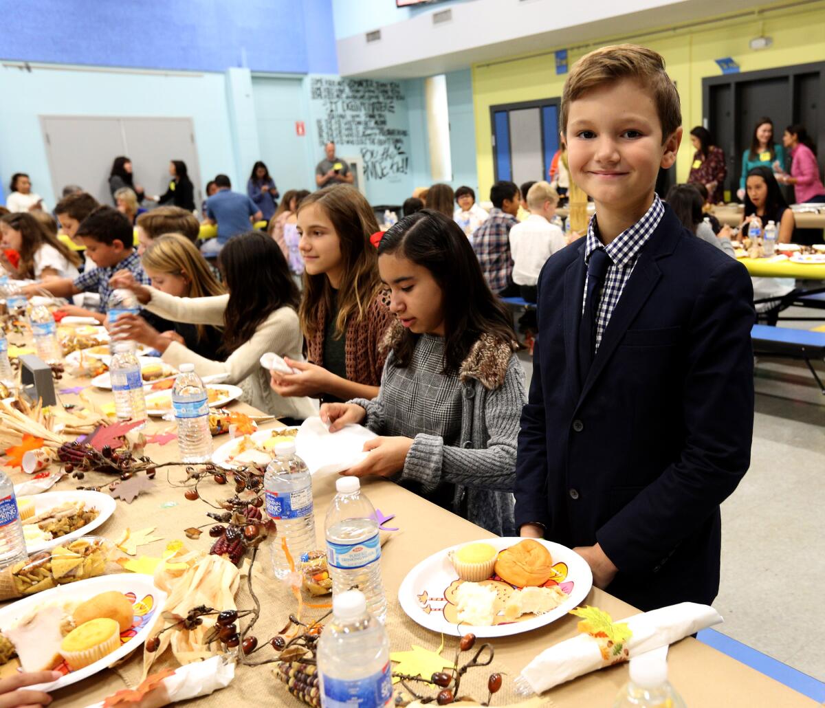 La Cañada Elementary School fifth-grader Miles Worster dressed up not in costume but in a jacket and tie for the school's annual Fifth-Grade Feast. Students and parents used to dress as pilgrims and Native Americans, but the tradition was changed after the school received complaints about perceived cultural insensitivity.