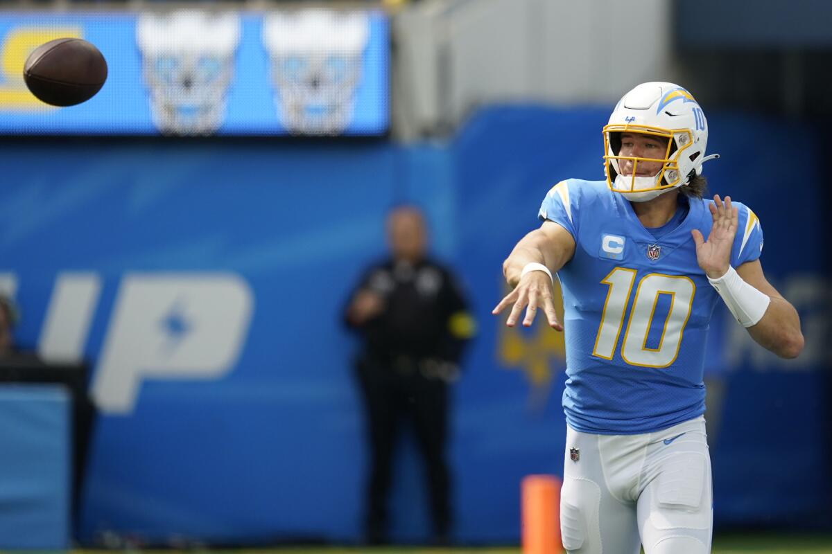 Chargers quarterback Justin Herbert throws the ball.