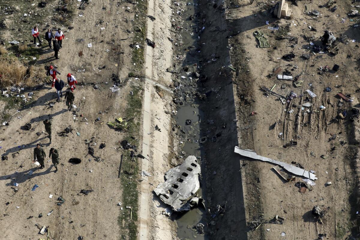 Rescue workers at the scene of a Ukrainian plane crash near Tehran on Jan. 8.