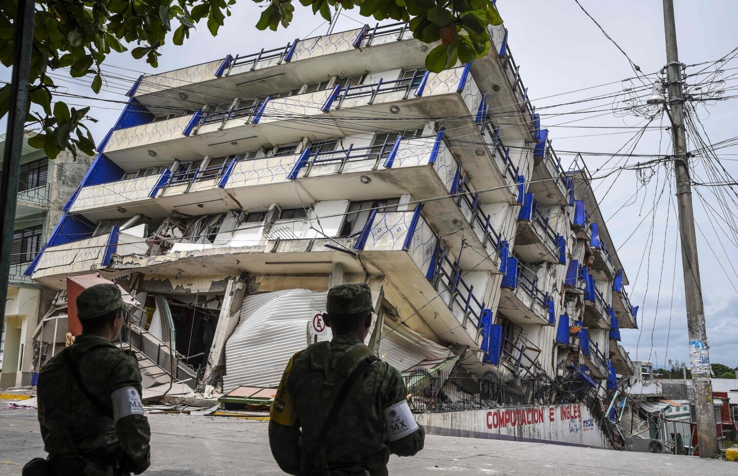 Soldiers stand guard near the Sensacion hotel which collapsed with the powerful earthquake that struck Mexico overnight, in Matias Romero, Oaxaca State.
