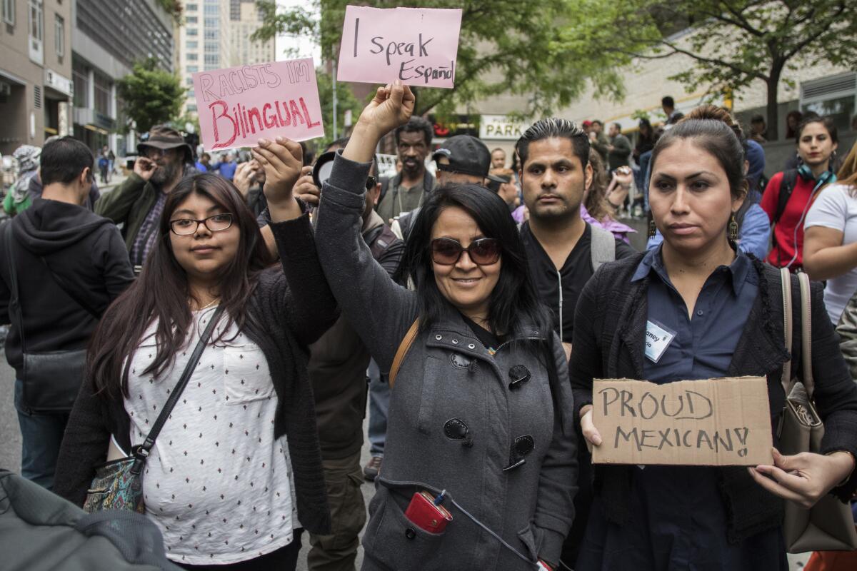 Marilyn Menzoa, left, Bianca Saavedra and Biany Garcia attend New York City rally against Aaron Schlossberg, the attorney whose recorded tirade against Latino restaurant workers went viral.