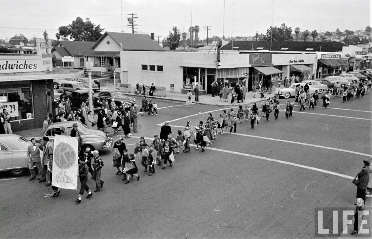 The Ocean Beach Kite Parade goes down Newport Avenue at Cable Street in 1954.