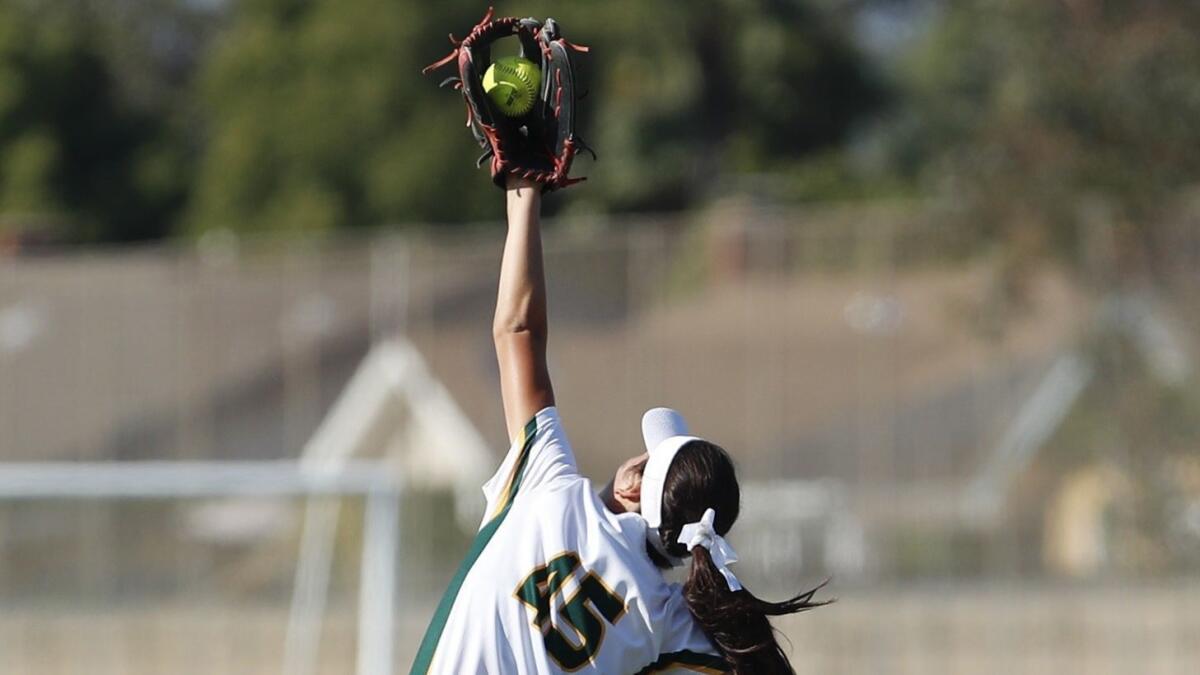 Edison High's Serena Starks catches a line drive near the fence during a Sunset League game against Marina on May 9.