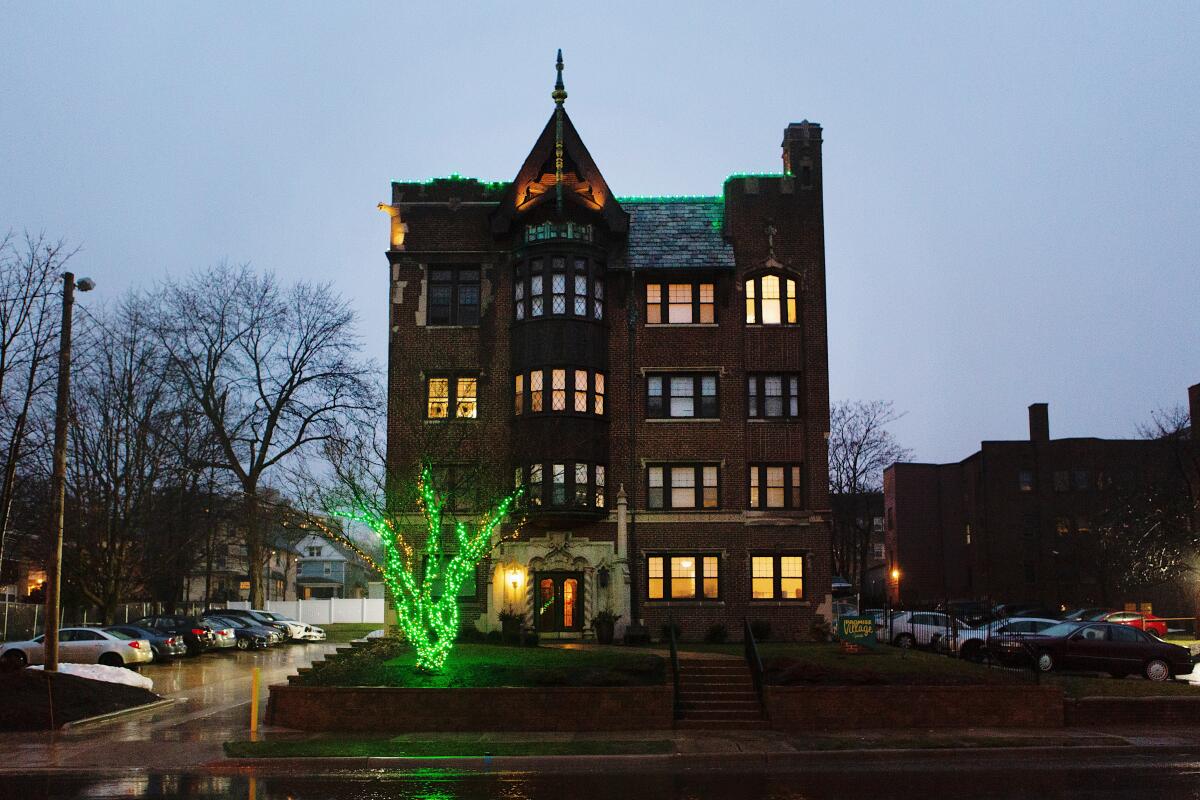 A tall brick building with lights