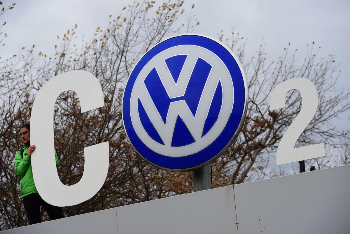 Greenpeace activists demonstrate at the entrance to the Volkswagen plant in Wolfsburg, Germany, on Nov. 9.