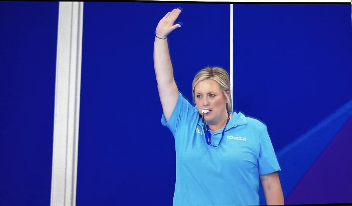 Jenn McCall referees at the World Aquatics Championships in Doha, Qatar in February.