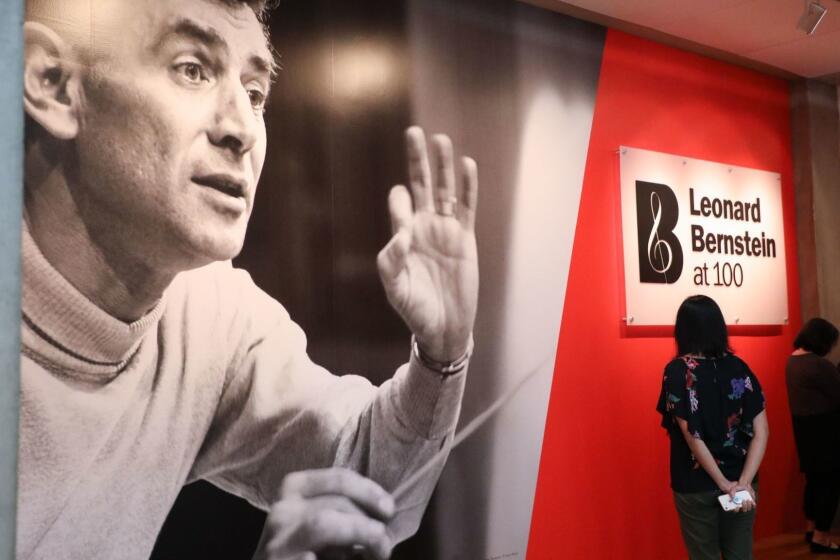 Mandatory Credit: Photo by EUGENE GARCIA/EPA-EFE/REX/Shutterstock (9642607h) Visitors enter the exhibition, Leonard Bernstein at 100, in memory of famed US musical icon Leonard Bernstein at the Skirball Cultural Center in Los Angeles, California, USA, 25 April 2018. The celebration of the late Bernstein marks 100 years since his birth and was curated by the GRAMMY Museum. Leonard Bernstein at 100 exhibit celebrates famed musical icon, Los Angeles, USA - 25 Apr 2018 ** Usable by LA, CT and MoD ONLY **