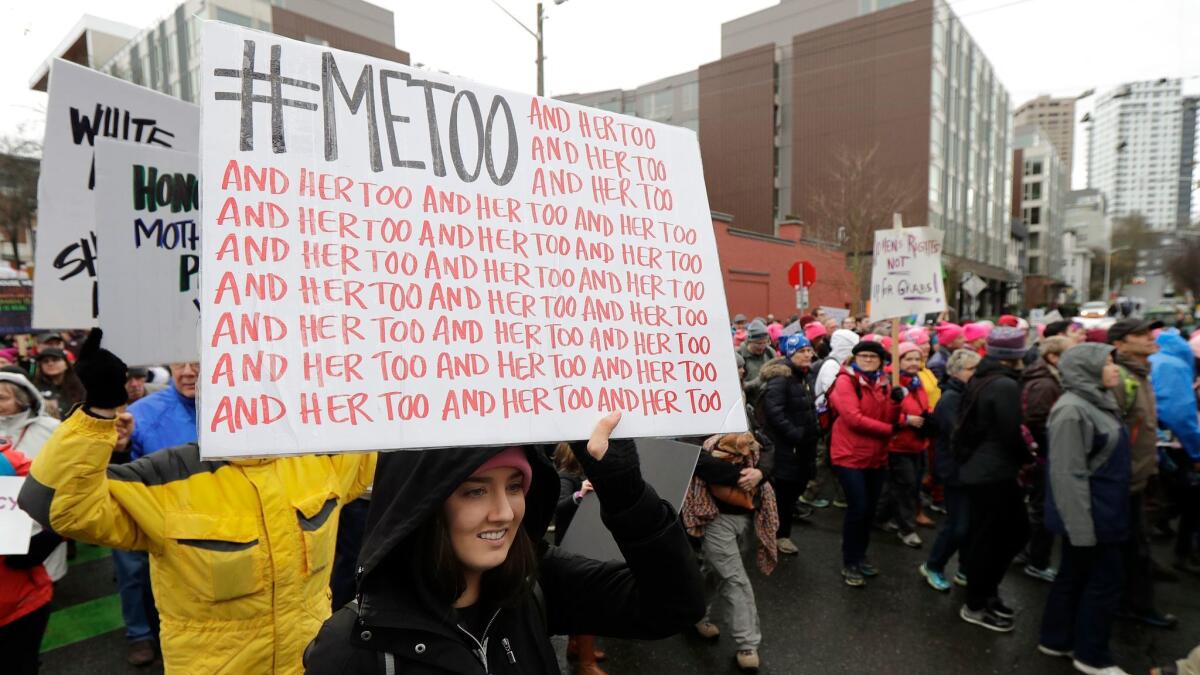 A marcher carries a sign with the popular Twitter hashtag #MeToo at a Women's March in Seattle on Jan. 20.