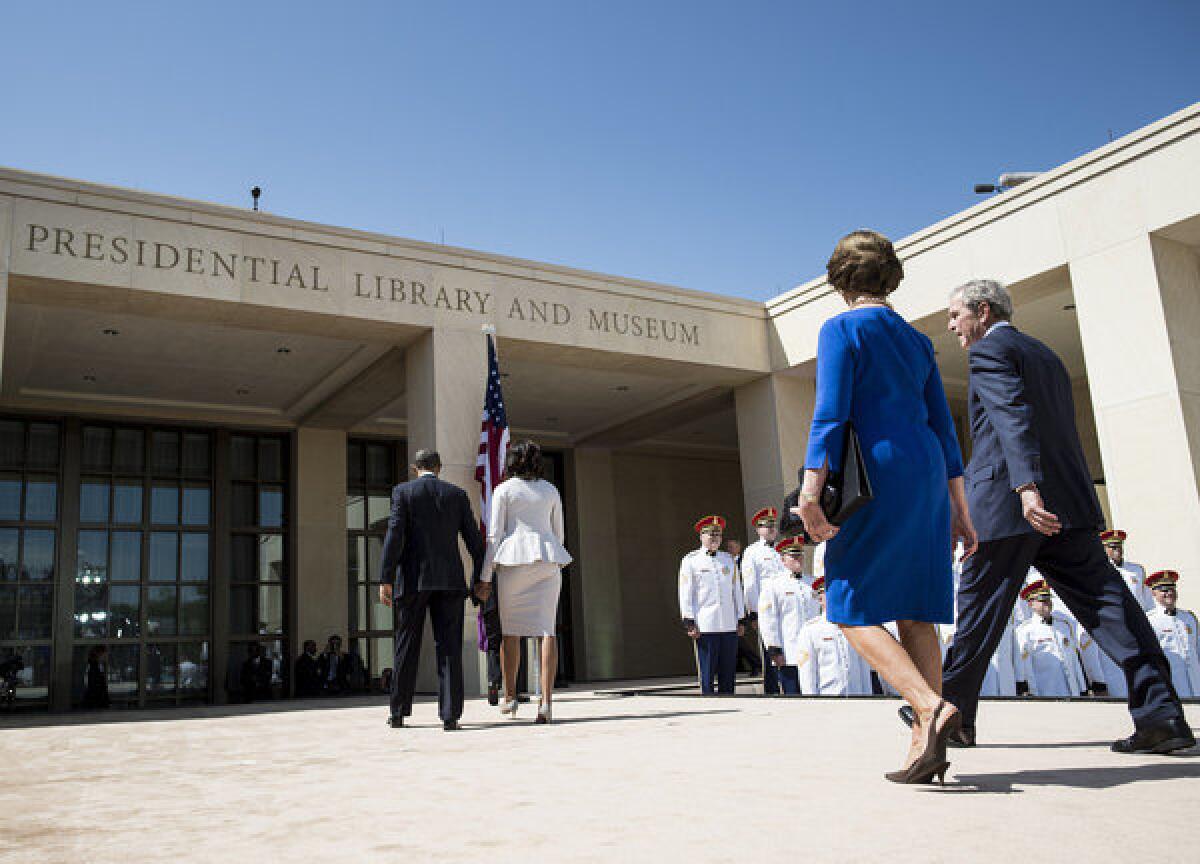 President Obama and First Lady Michelle Obama and former President George W. Bush and Laura Bush depart after the dedication ceremony at the George W. Bush Presidential Library and Museum in Dallas.