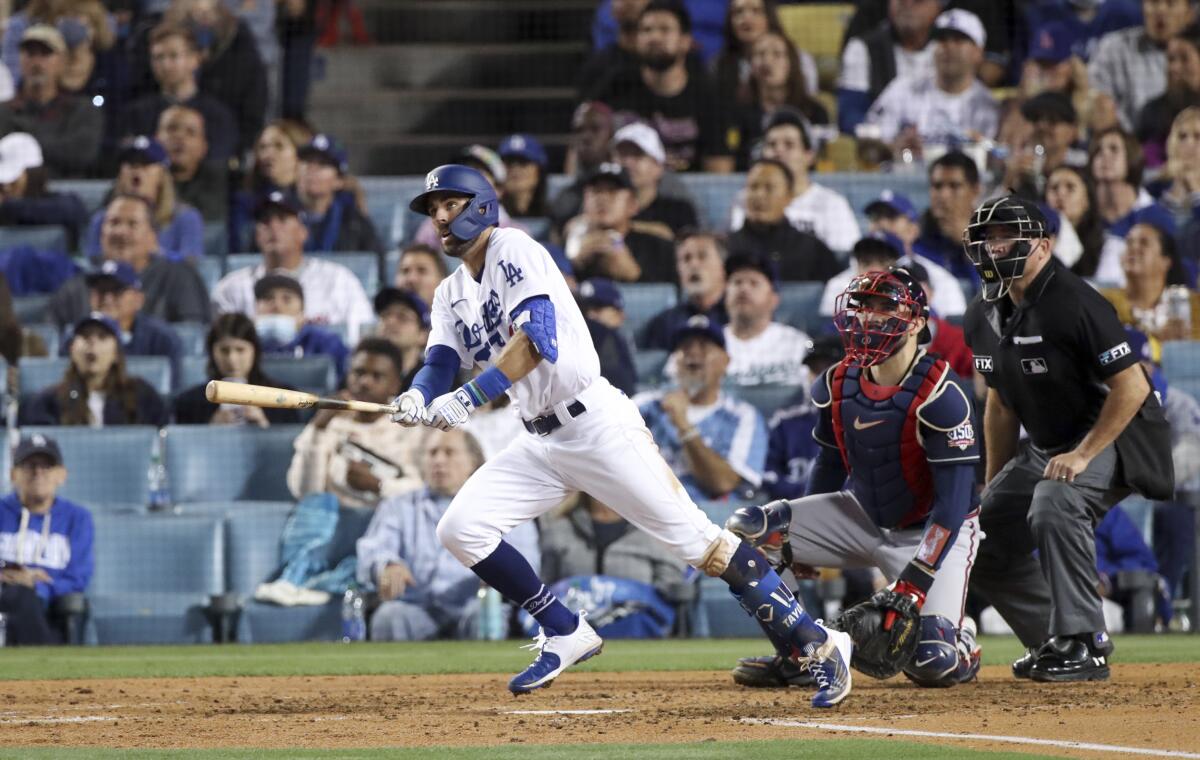 Dodgers' Chris Taylor looks up after hitting a two-run home run.