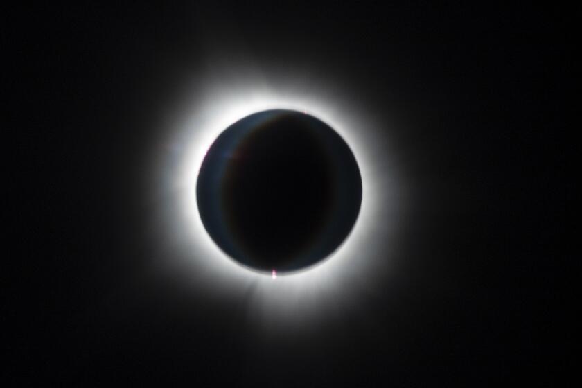 The total solar eclipse is seen from an Alaska Airlines flight from San Diego to Washington Dulles International Airport.