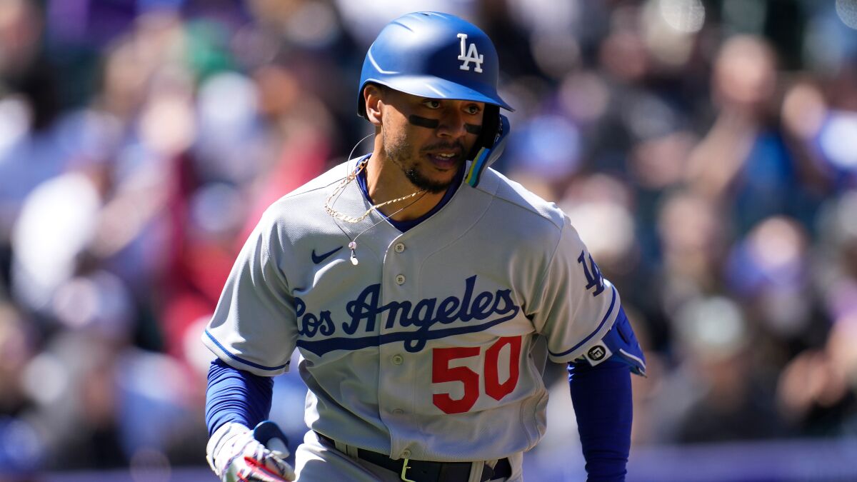 Dodgers right fielder Mookie Betts runs to first base during Sunday's loss to the Colorado Rockies.