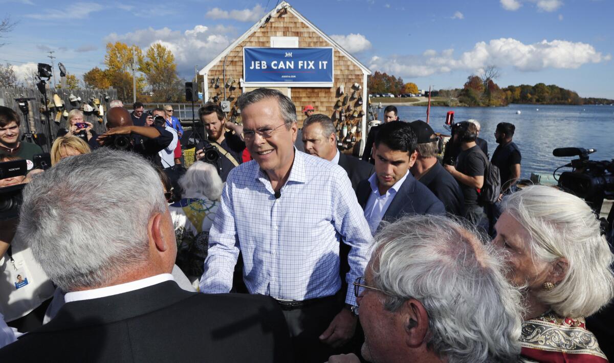 Republican presidential candidate Jeb Bush shakes hands with supporters during a campaign stop in Portsmouth, N.H., on Oct. 29, 2015.