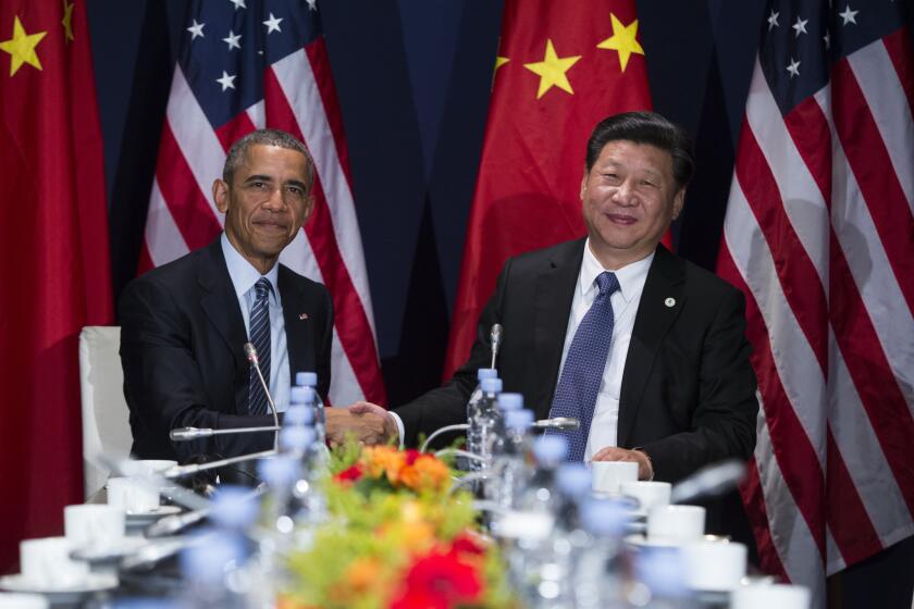 President Obama meets with Chinese President Xi Jinping during the United Nations climate change summit on Nov. 30.