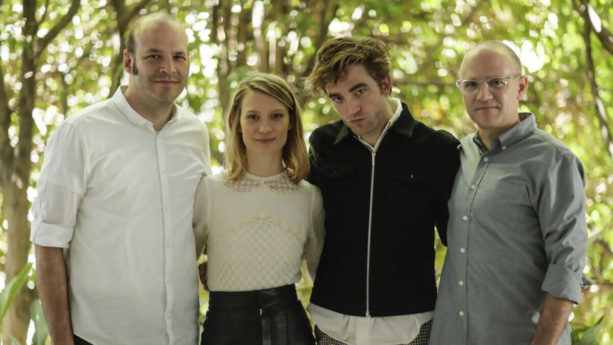 Filmmakers David Zellner, far right and Nathan Zellner, far left, with actors Mia Wasikowska and Robert Pattinson, who star in "Damsel," an oddball western.