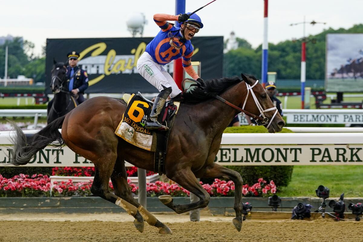 Mo Donegal and jockey Irad Ortiz Jr. cross the finish line Saturday to win Belmont Stakes at Belmont Park in Elmont, N.Y.
