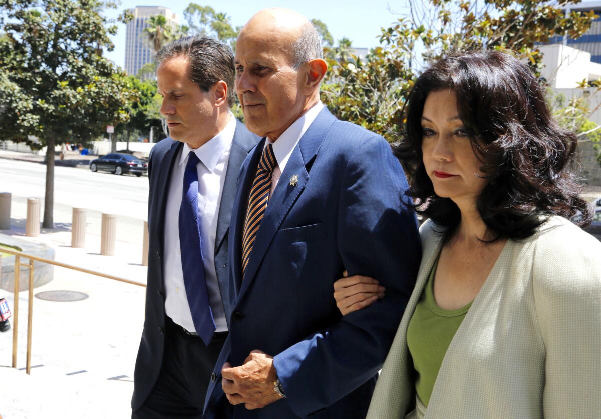 Former Los Angeles County Sheriff Lee Baca and his wife, Carol, arrive at federal court in Los Angeles earlier this year. He is charged with conspiring to obstruct justice, obstructing justice and making false statements to the federal government.