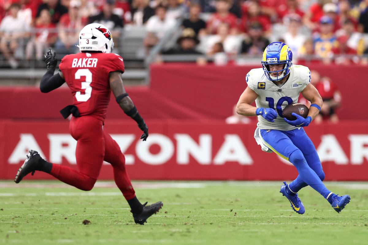 The Cardinals' Budda Baker pursues Cooper Kupp after the Rams receiver made a catch. 