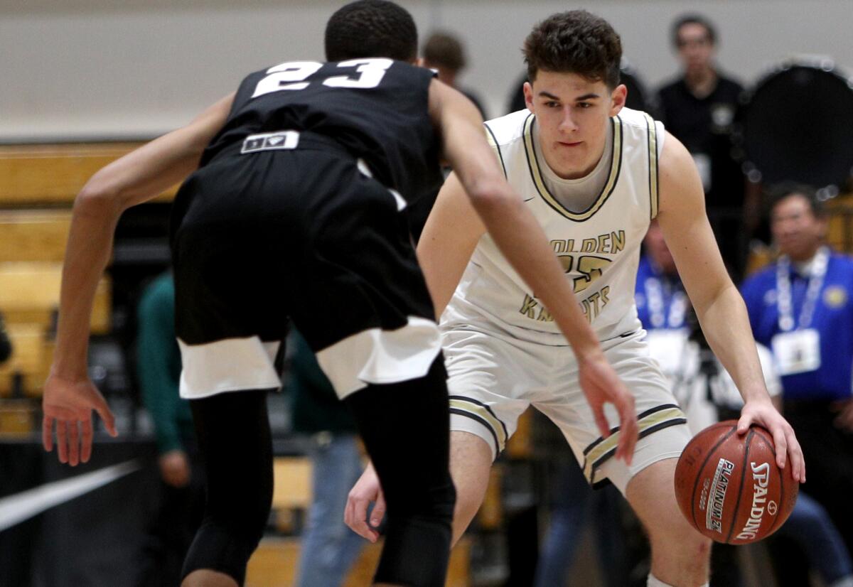 St. Francis player Jason Gallant looks to get by the defender Kyjuan Cannady in the CIF SS Div. 2AA Basketball Finals vs. Santa Clarita Christian, at Azusa Pacific University in Azusa on Saturday, Feb.29, 2020. SFHS came up short 61-39.