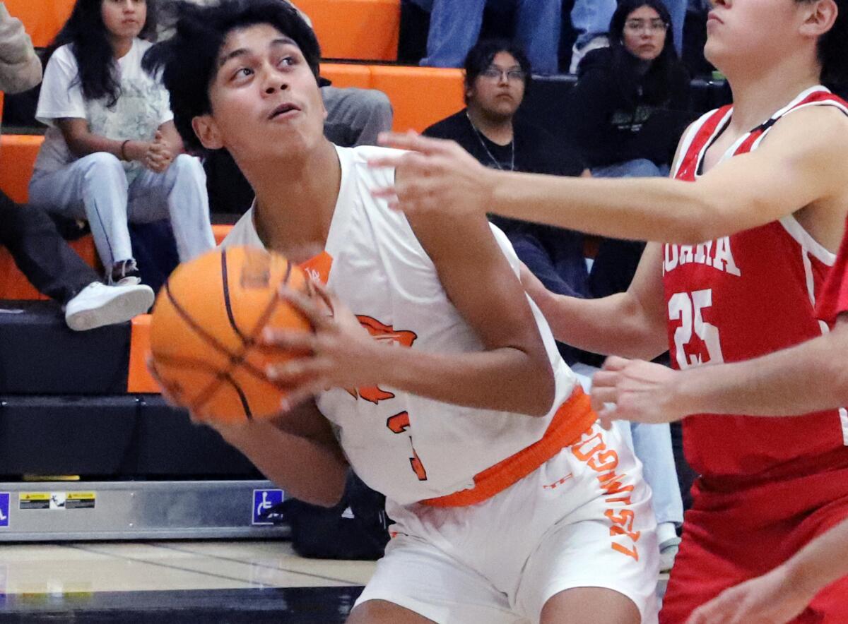 Joshua Martinez (3) of Los Amigos looks for an open shot against Loara during Friday night's game.