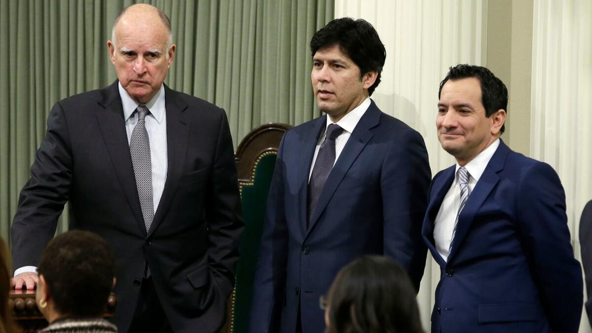 California Gov. Jerry Brown, from left, Senate President Pro Tem Kevin de León (D-Los Angeles) and Assembly Speaker Anthony Rendón (D-Paramount) at the Capitol in Sacramento in March.