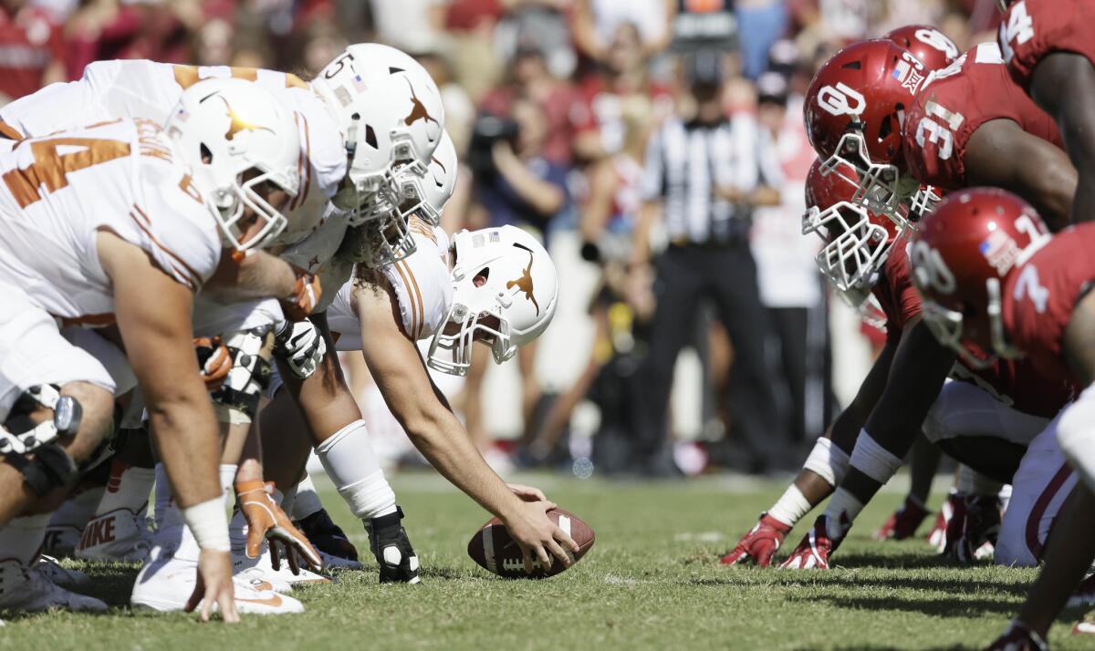 Oklahoma and Texas line up for play during the second half of the Red River Rivalry on Oct. 8.
