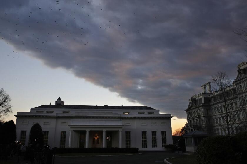 A cloud passes over the West Wing of the White House at sunset, Tuesday Jan. 8, 2019, a few hours before President Donald Trump is scheduled to make an address to the nation in Washington. (AP Photo/Jacquelyn Martin)
