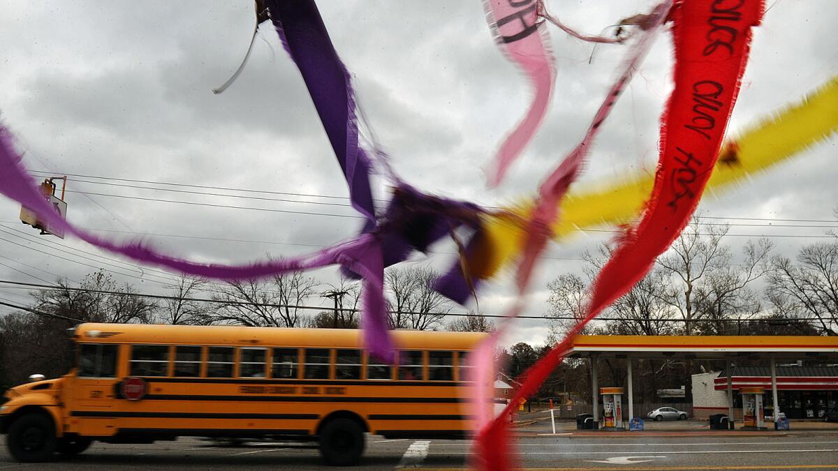 FERGUSON, MISSOURI NOVEMBER 24, 2014-Ribbons fly from a fence on a cold windy morning along South Florissant Road in Ferguson, Missouri Sunday. The message on the ribbons ask for peace and prayers for shooting victim Michael Brown. (Wally Skalij/Los Angeles Times)
