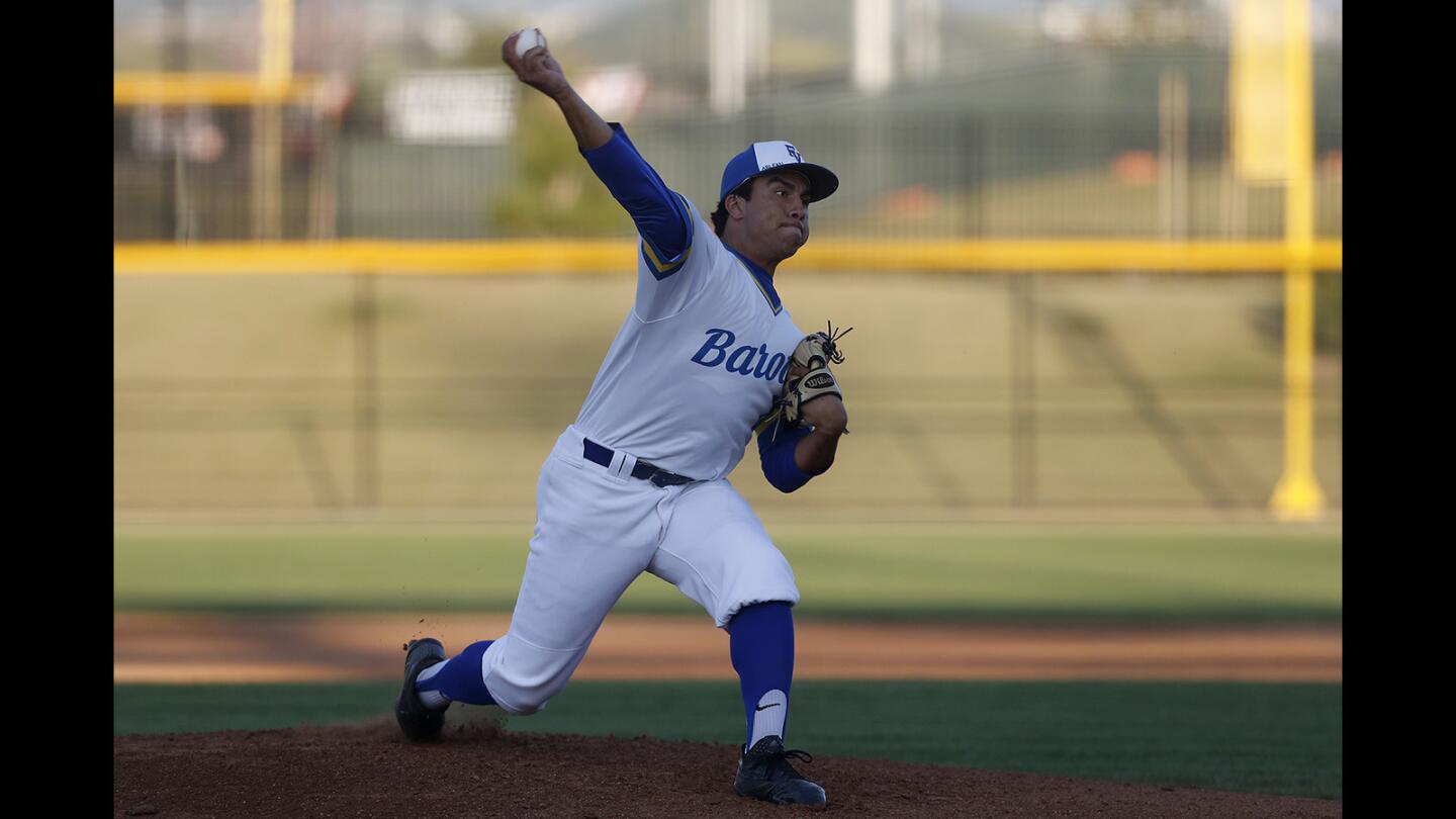Fountain Valley High starter Jackson Ouellete pitches against Trabuco Hills in the first inning during the first round of the Ryan Lemmon Baseball Tournament at Orange County Great Park in Irvine on Saturday, March 30, 2019.
