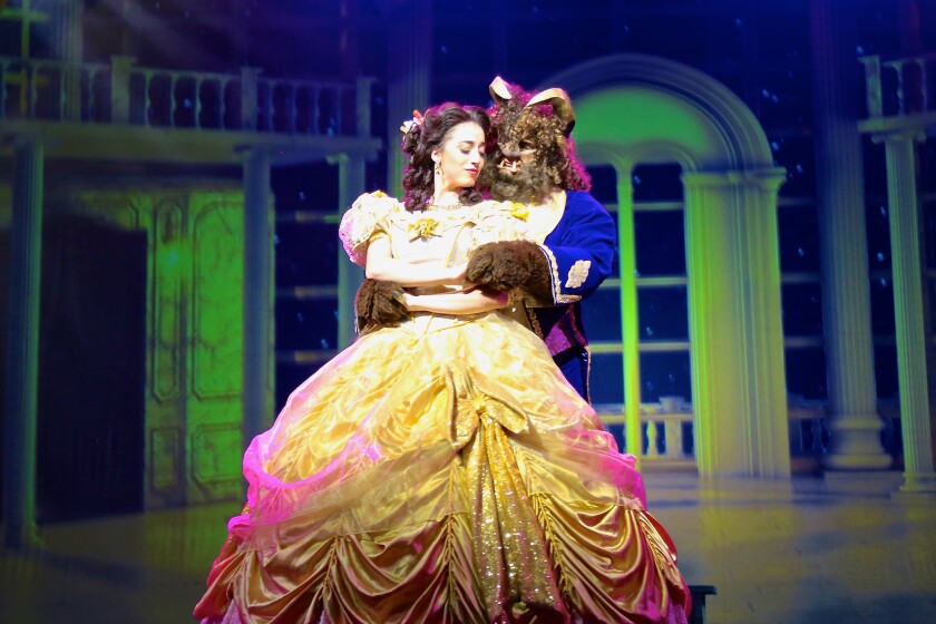 Jenna Lea Rosen as Belle and Michael Deni as Beast in Moonlight Stage Productions' "Beauty and the Beast"