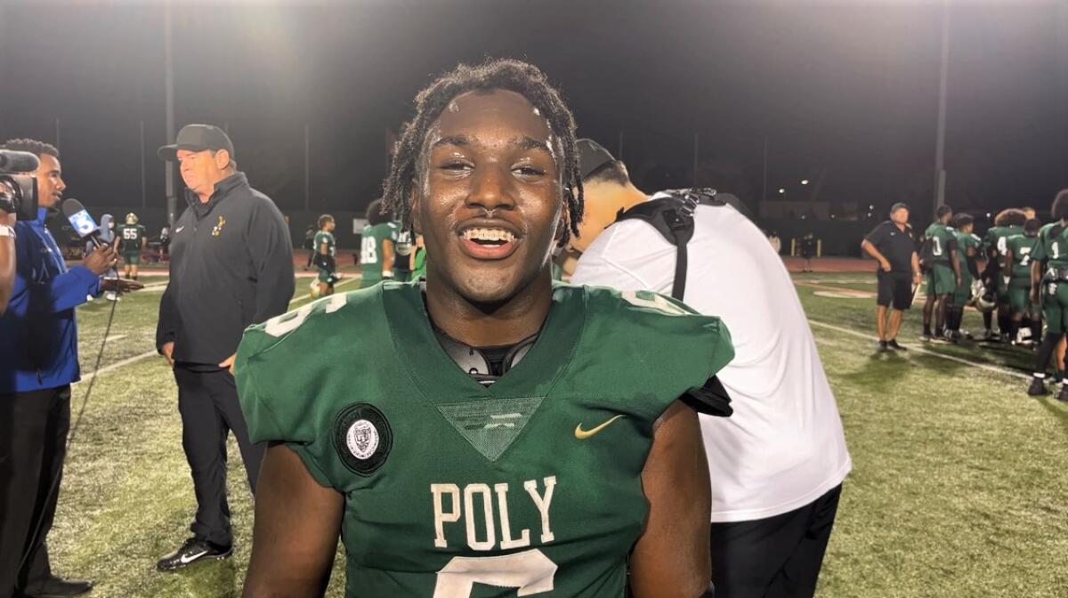 Long Beach Poly's Devin Samples is all smiles after a 17-3 win over Gardena Serra.