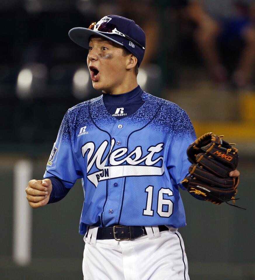 Walker Lannom (16) begins to celebrate his team's 11-3 win over Bowling Green, Ky.