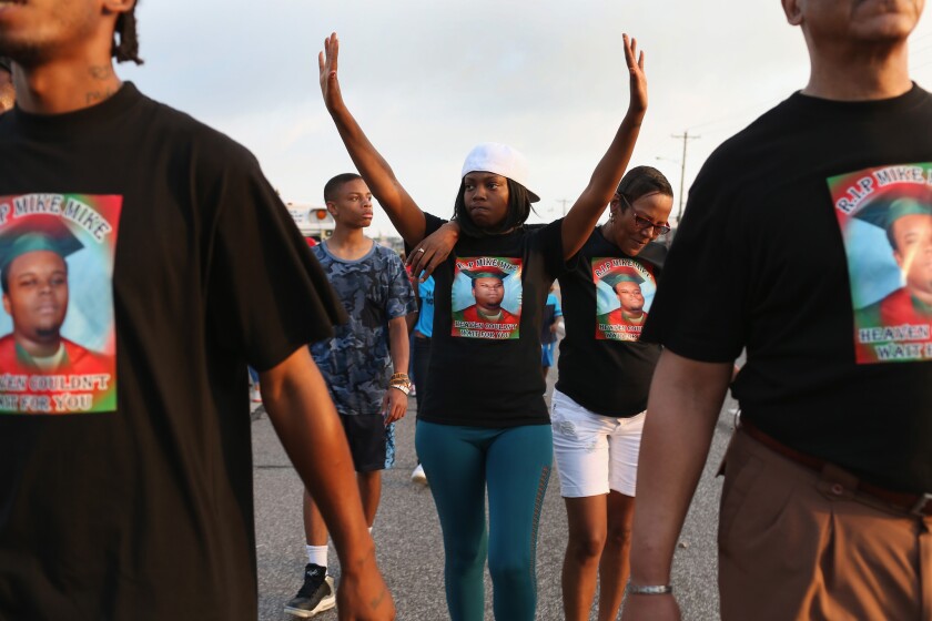 A demonstration in Ferguson, Mo., last summer, just days after Michael Brown was fatally shot by police.