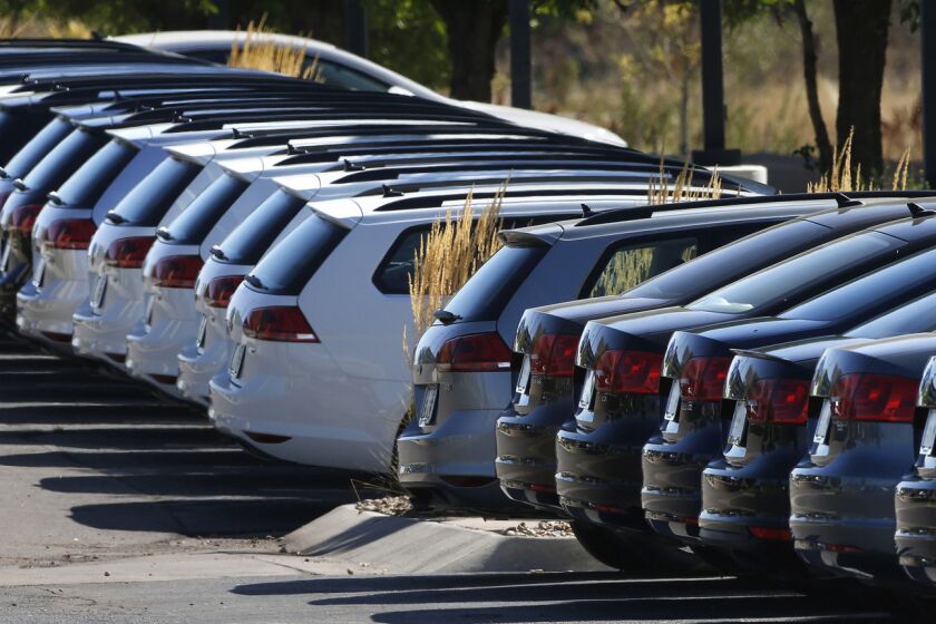 Volkswagens are lined up on a dealer's lot in Boulder, Colo., on Sept. 24, 2015.