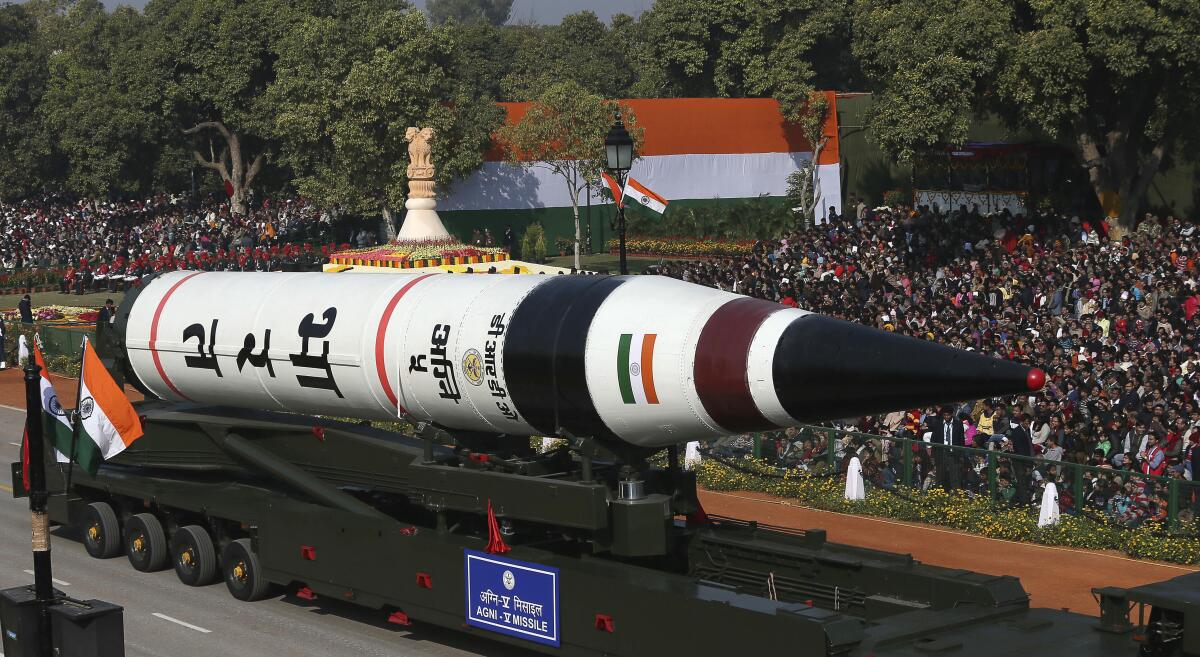 A missile is driven along a parade route in India.